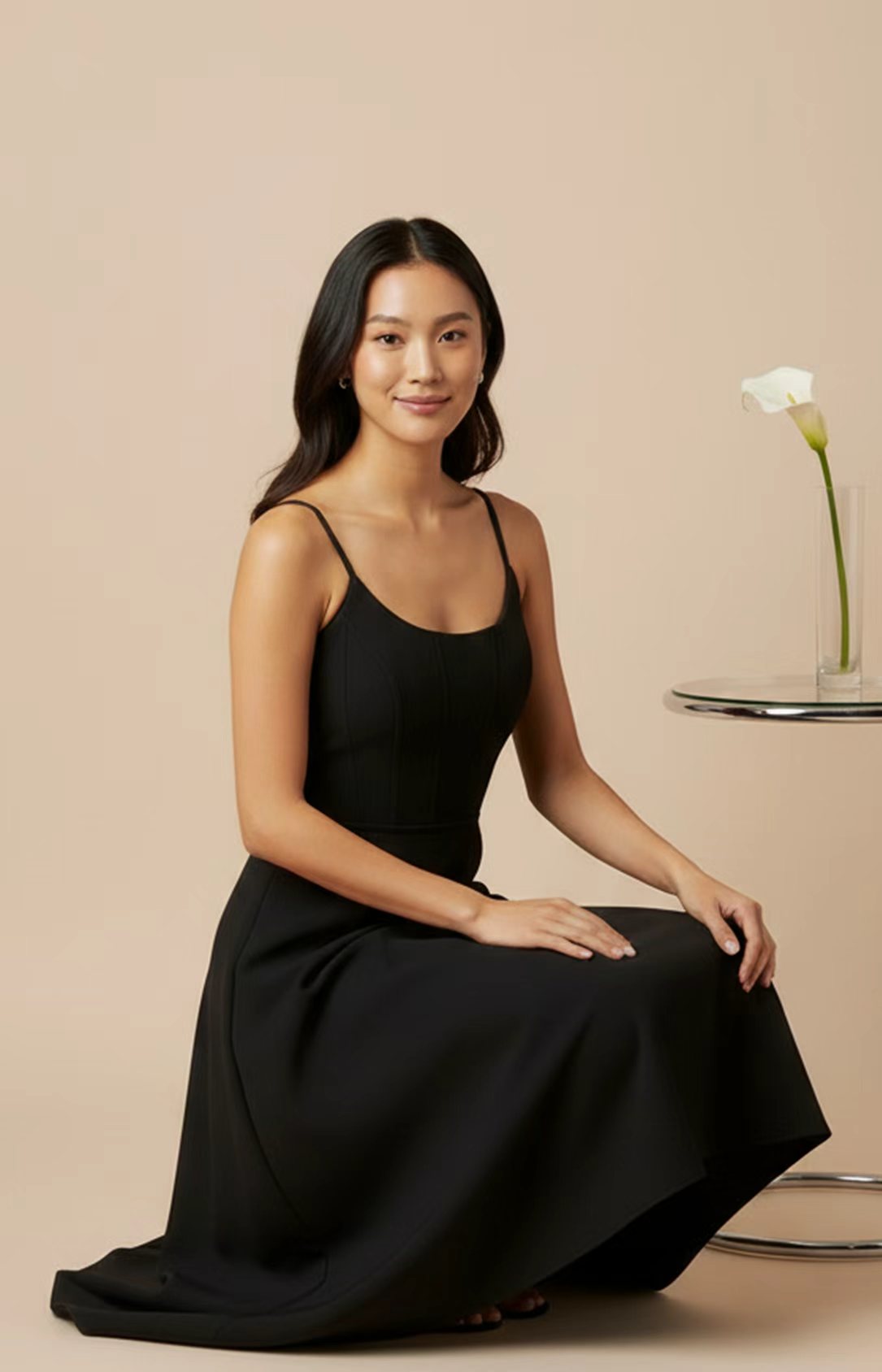 Black crepe A-line midi dress seated view