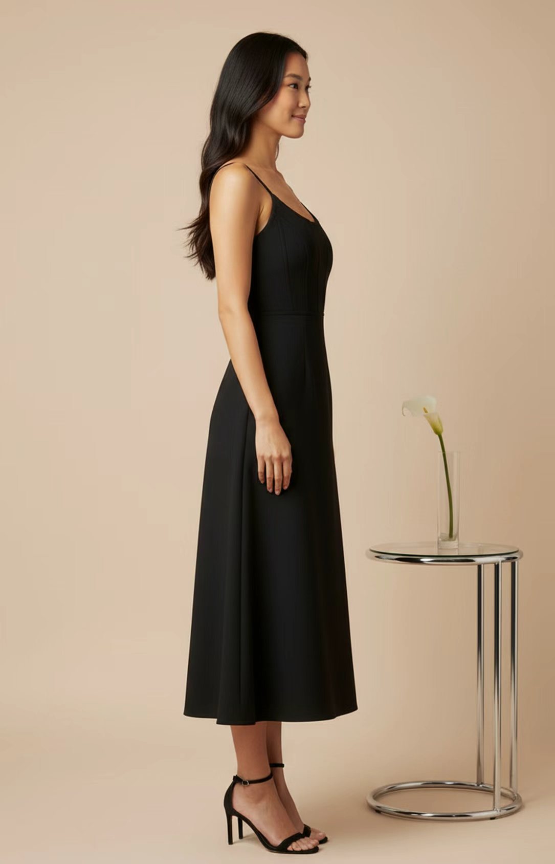 Side view of black A-line midi dress