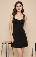 Black stretch knit homecoming dress with defined waist and structured 