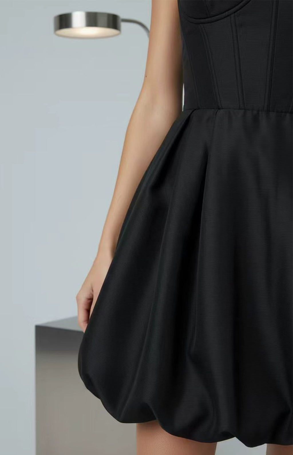 Black satin bubble hem corset homecoming dress fabric detail
