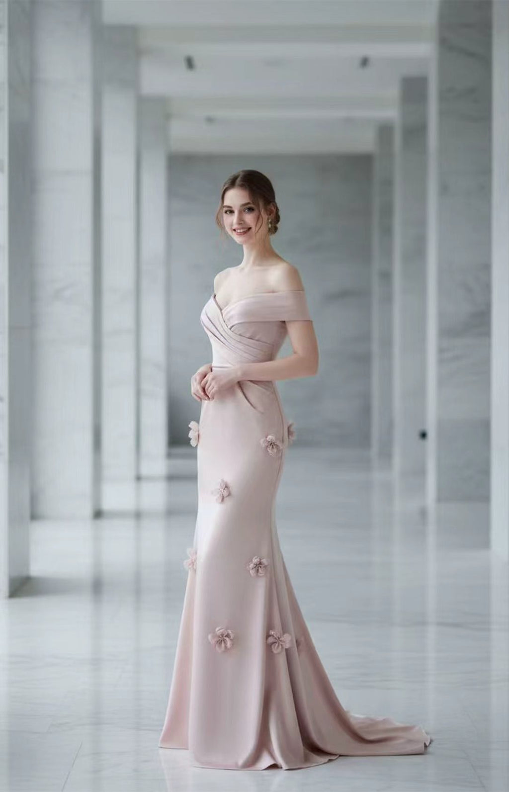 Blush pink off-the-shoulder mermaid evening gown with 3D floral appliques and ruched bodice