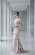 Blush pink off-the-shoulder mermaid evening gown with 3D floral appliques and ruched bodice