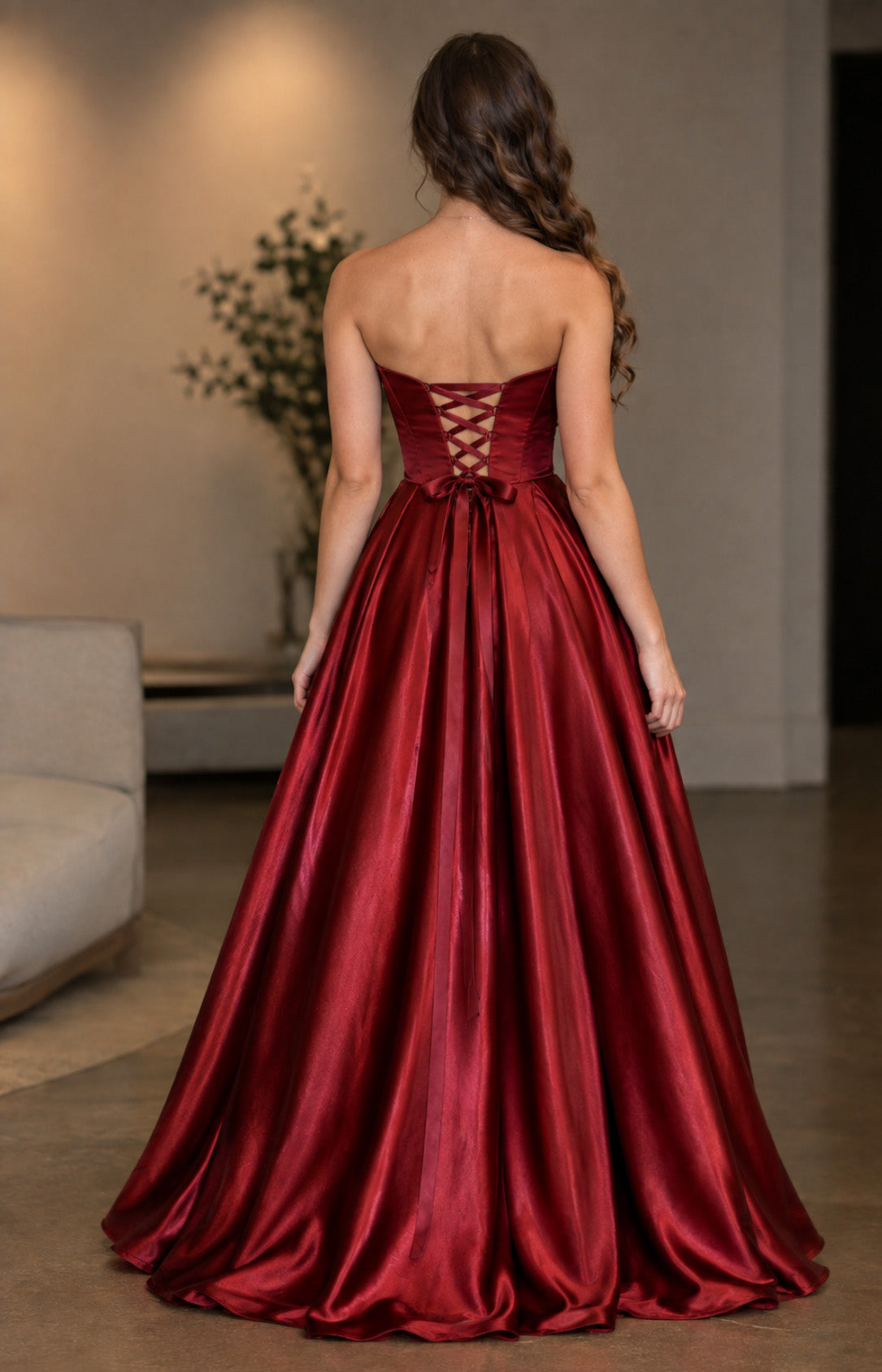 Burgundy satin A-line prom dress with lace-up corset back and bow