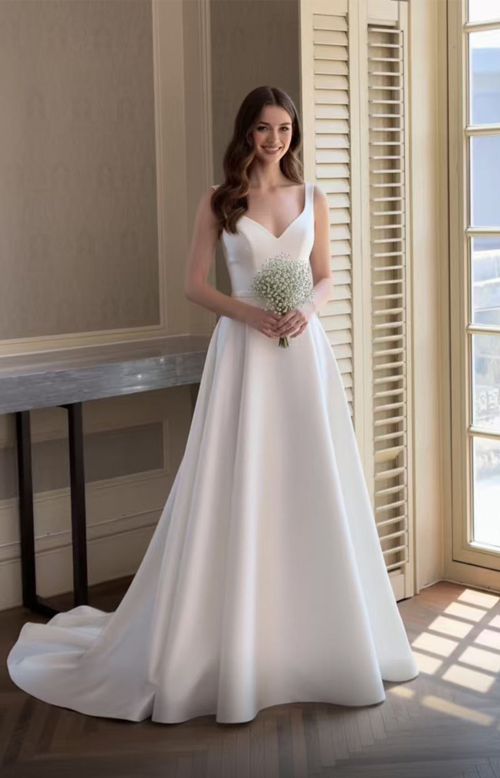Elegant minimalist satin A-line wedding dress with V-neckline, designed for modern US brides - XALPHEOR