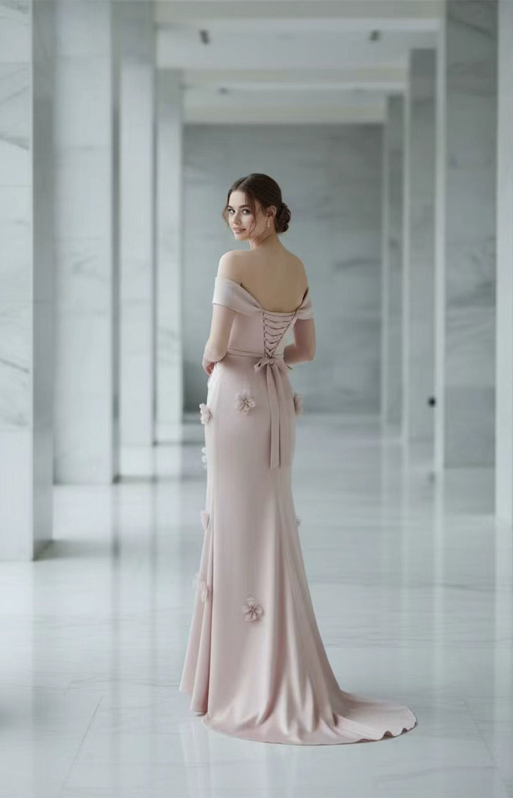 Lace-up corset back of blush pink mermaid prom dress with 3D floral details and sweep train
