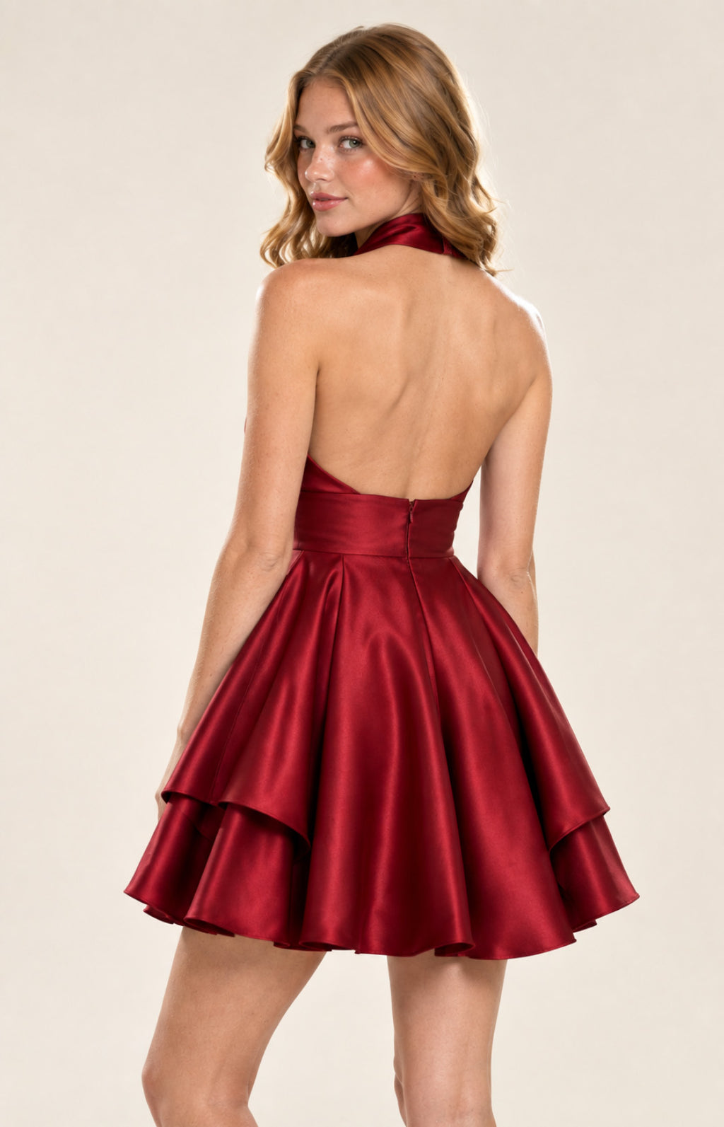 Red satin open back halter A-line homecoming mini dress with back zipper and tiered skirt, back view