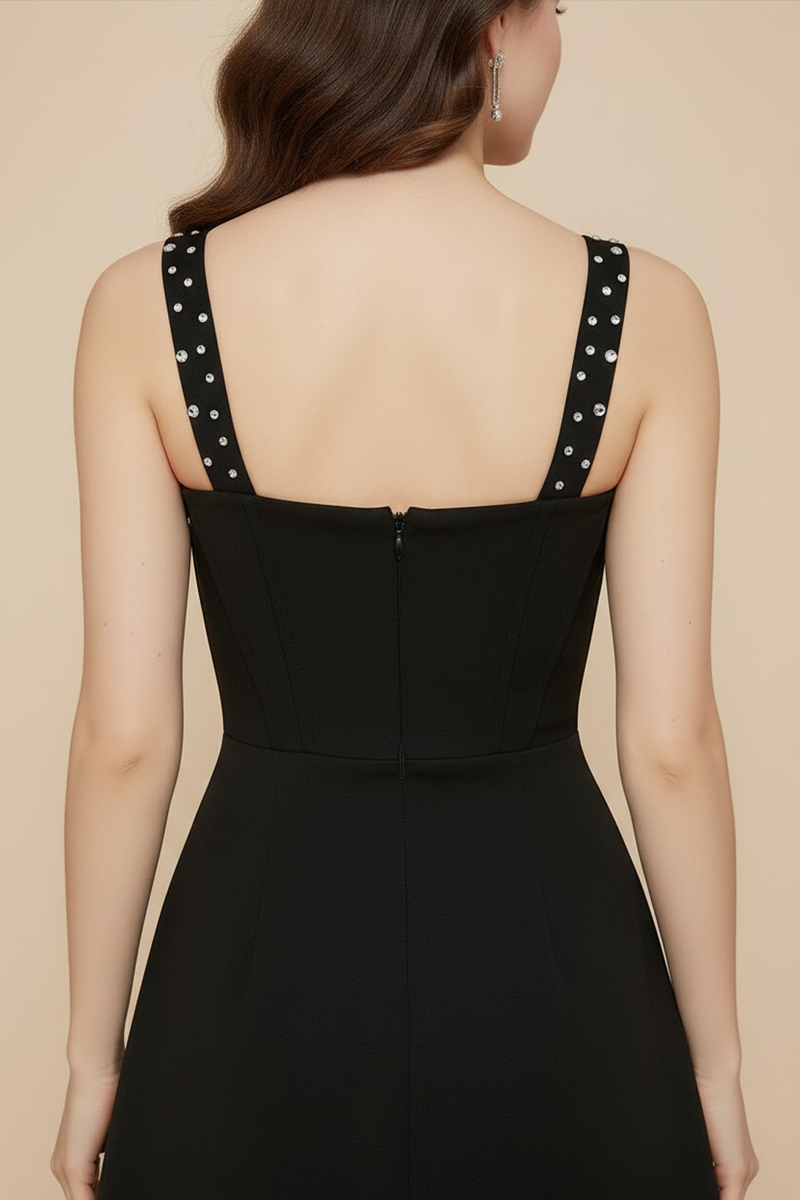 Black stretch knit A-line homecoming dress with concealed back zipper and rhinestone straps