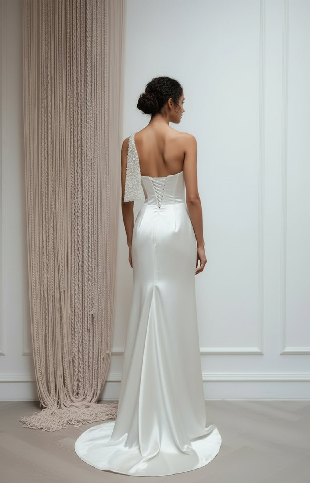 White one-shoulder satin evening gown with corset lace-up back and pearl detailing