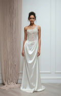 White one-shoulder satin evening gown with pearl beaded bodice, front view